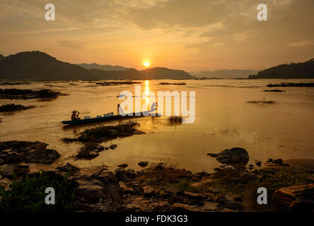 Two fisherman rowing, Mekong river, Sangkhom, Thailand Stock Photo