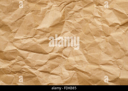 Old crumbled brown paper background Stock Photo