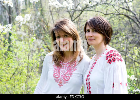 Smiling women in Ukrainian traditional dresses Stock Photo