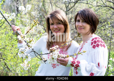 Smiling women in Ukrainian traditional dresses Stock Photo