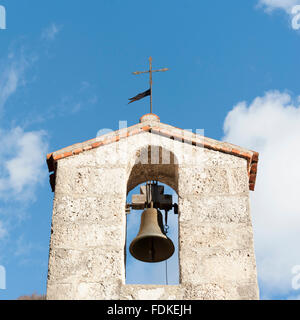 Small bell tower with a bell of a country church in the 15th century Stock Photo