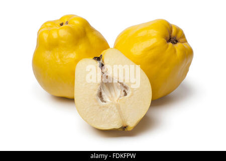 Fresh whole and half yellow Quinces on white background Stock Photo