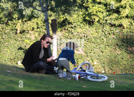 Olivier Martinez takes his son Maceo to Coldwater Canyon Park in Beverly Hills where he teaches him how to ride a bike  Featuring: Olivier Martinez, Maceo Martinez Where: Los Angeles, California, United States When: 31 Dec 2015 Stock Photo