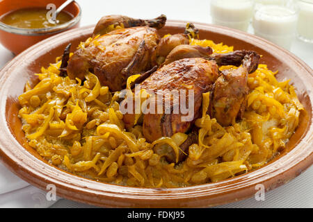 Couscous Tfaya, Moroccan Couscous with chicken and caramelized Onions, almonds Stock Photo