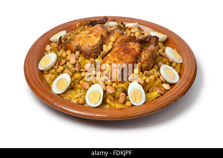 Couscous Tfaya, Moroccan Couscous with chicken and caramelized Onions, almonds and hard boiled eggs Stock Photo