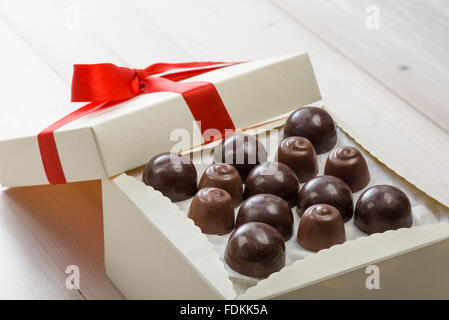 assorted chocolates confectionery on wooden table Stock Photo