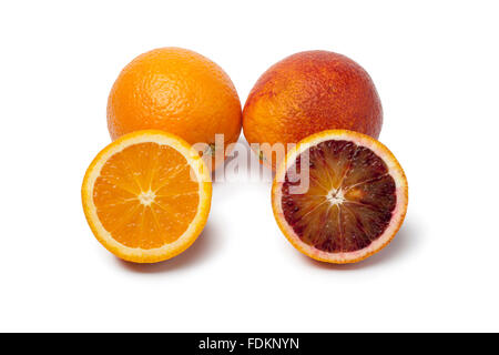 Whole and half Oranges and blood oranges on white background Stock Photo