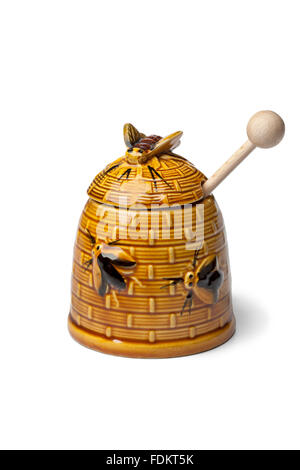 Classic ceramic honey pot on white background Stock Photo