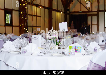 Wedding reception in rustic english barn with details, cake and decorations Stock Photo