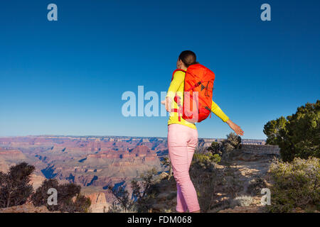 Young woman hiker on the edge of Grand canyon Stock Photo