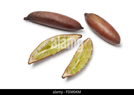 Whole and half finger limes on white background Stock Photo