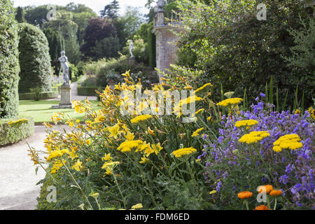 Achillea and Hemerocallis on the Orangery Terrace in the garden in July at Powis Castle, Powys, Wales. Stock Photo