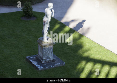 View over the lead statue of a shepherd by John Van Nost on the Orangery Terrace at Powis Castle and Garden, Welshpool, Powys. Stock Photo