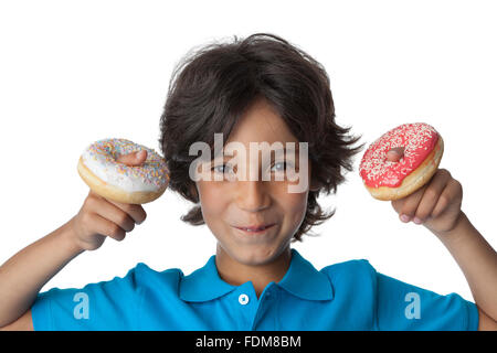 Little boy making fun with donuts on white background, Stock Photo