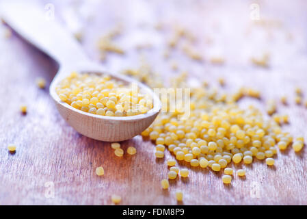 ptitim in wooden spoon and on a table Stock Photo
