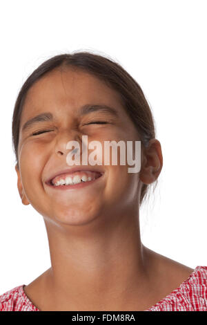 Young teenage girl closing eyes with excitement, portrait on white background Stock Photo