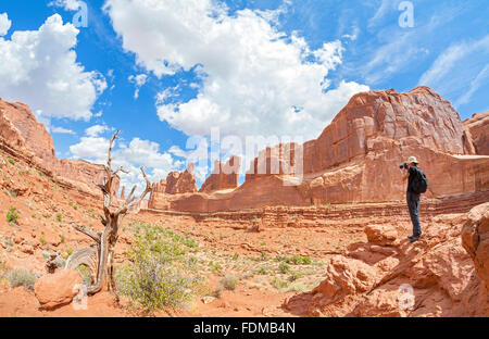 Tourist taking pictures of a beautiful scenery in Canyonlands National Park, Utah, USA. Stock Photo