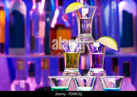 Closeup of shot pyramid  glasses with limes Stock Photo