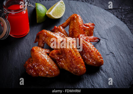 fried chicken wings on a black stone Stock Photo