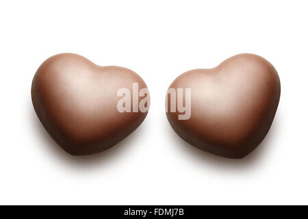 Two chocolate hearts isolated on the white background. Stock Photo