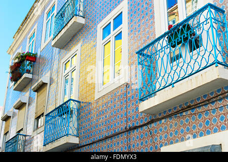 Lisbon building wall with balcony and traditional Portuguese tile Stock Photo
