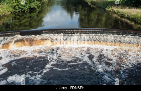 Weir on the River Wenning at Hornby in Lancashire Stock Photo