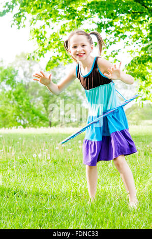 Girl with hula hoop Stock Photo