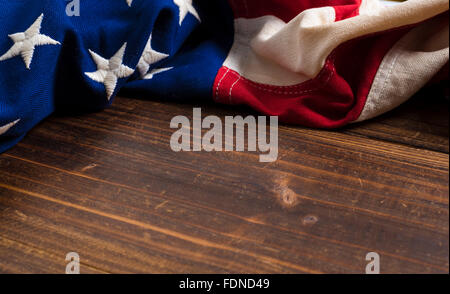 An old american flag on a antique wooden platform with copy space Stock Photo