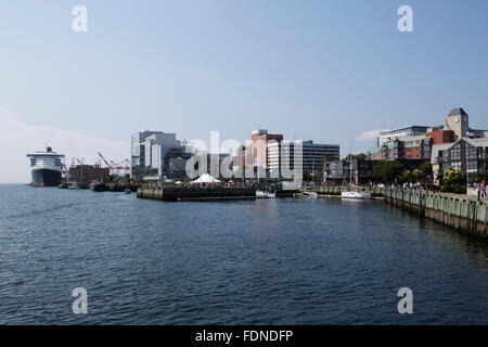 The Queen Mary 2 cruise ship moored by wooden wharves by the waterfront in Halifax, Canada. Stock Photo