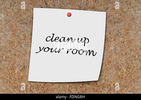 clean up your room written on a memo pinned on a coak board Stock Photo