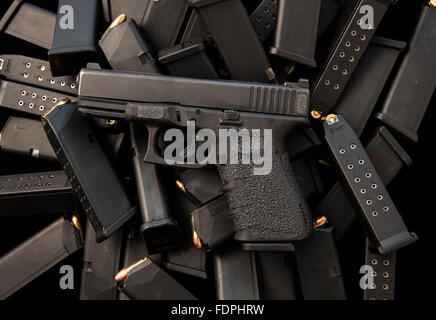 Glock semiautomatic 9mm handgun with high capacity magazines and ammunition Stock Photo