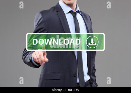 Businessman touching a download button on virtual screen. internet concept Stock Photo