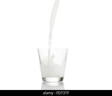 glass of splashing milk isolated on white background Stock Photo