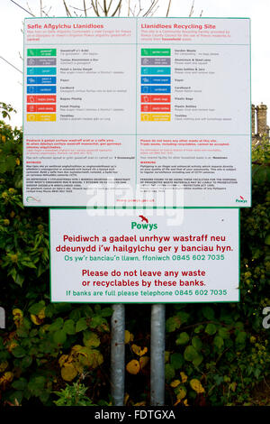 Recycling - bilingual English/Welsh sign outside a recycling centre. Llanidloes, Powys, Wales. October. Stock Photo