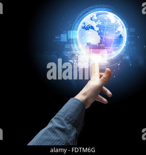 Human hand holding our planet earth glowing Stock Photo