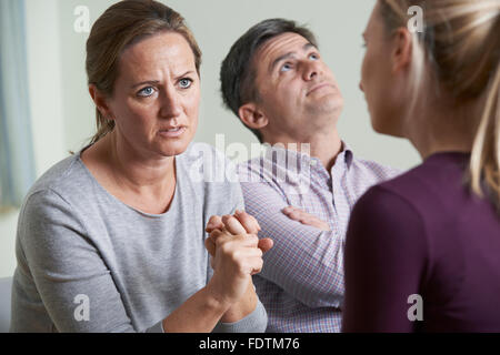 Couple Discussing Problems With Relationship Counsellor Stock Photo