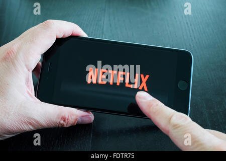 Logo of Netflix on-demand Movie and TV streaming service app on iPhone 6 plus smart phone Stock Photo