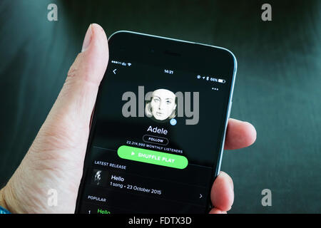 Spotify online music streaming app showing Adele on an iPhone 6 plus smart phone Stock Photo