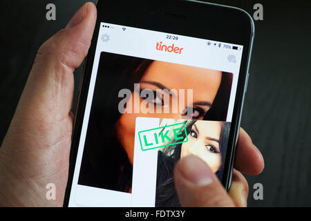 Tinder online dating app on an iPhone 6 Plus smart phone Stock Photo