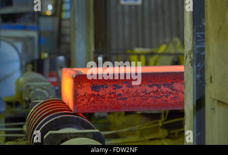 hot steel on conveyor in steel mill Stock Photo