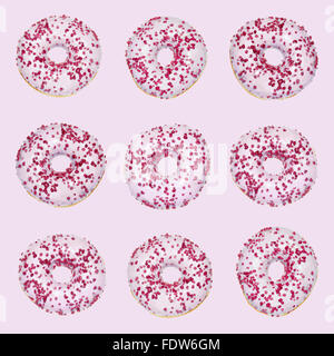 Pattern of Pink donut with red sprinkles Stock Photo