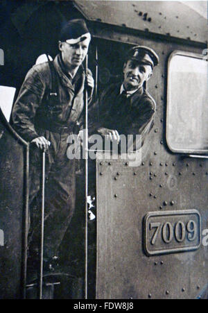 Train driver Charles Brown (right) with a colleague aboard the Athelney Castle (7009)  a Castle Class steam train in the 1950's. Stock Photo