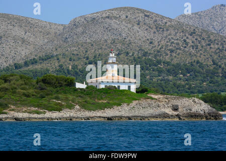 Alcanada lighthouse seen from the sea on a sunny summer day in July Stock Photo