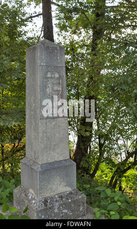 stone pillar with an inscription Land Salzburg and city Coat of Arms on the Mondsee Lake shore in Austria Stock Photo