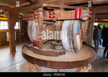 Workings inside Spice Windmill De Huisman, with three pairs of millstones grinding wheel wheels which grind various spices. Zaanse Schans. Netherlands Stock Photo