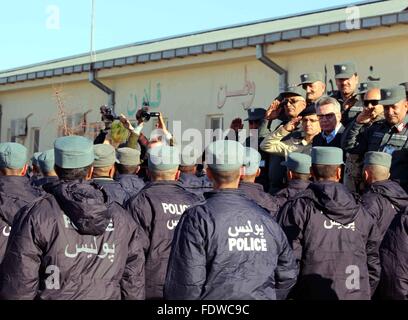 Masar-i-Sharif, Afghanistan. 2nd Feb, 2016. German Interior Minister Thomas de Maiziere (in background 3.f.r, CDU) pictured during a parade by newly trained Aghan police recruits at the police training centre in Masar-i-Sharif, Afghanistan, 2 February 2016. Germany started to train Afghan police officers in 2002 and set up several training centres. Over the years, training and advanced training for around 73,000 Afghan police officers has been organised there. Photo: Abdul Mutalib Sultani/dpa/Alamy Live News Stock Photo