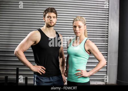 Fit couple with hands on hips Stock Photo