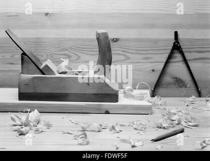 Old plane, and a compass on the table Stock Photo