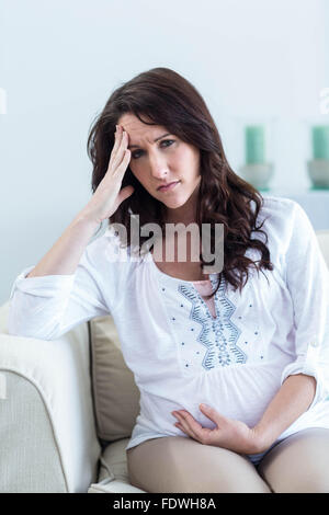 Pregnant woman with headache Stock Photo