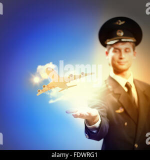 Image of pilot with airplane taking off from his hand Stock Photo